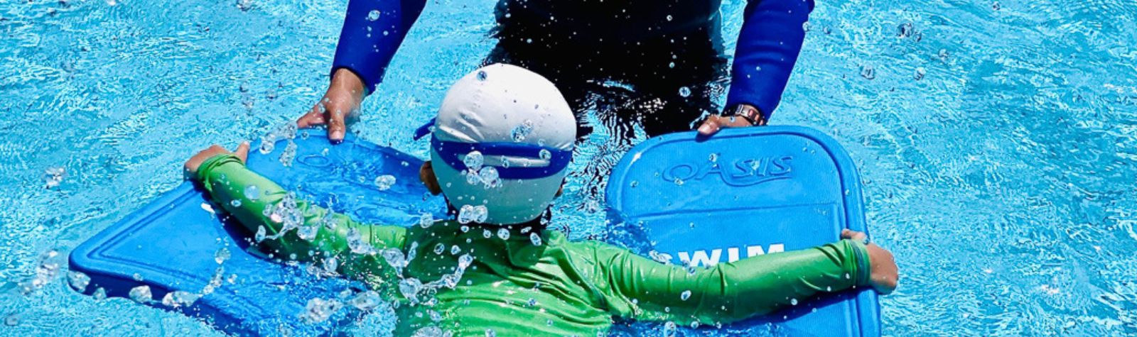 A Young Child Learning to Swim at The Swim Lab
