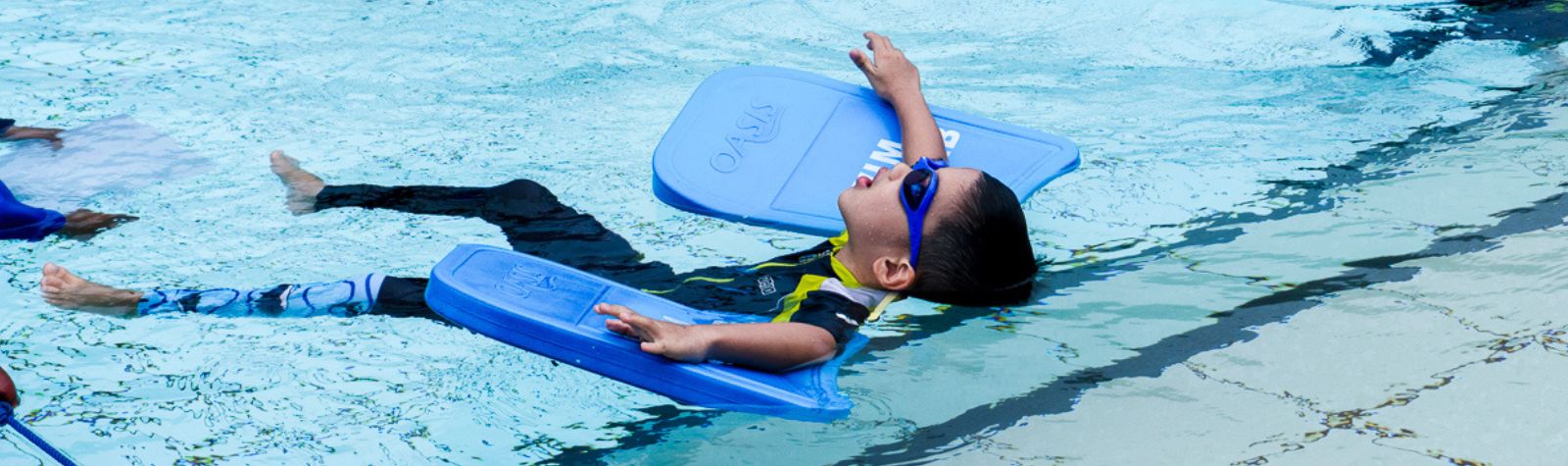 Child Learning BackStroke at The Swim Lab