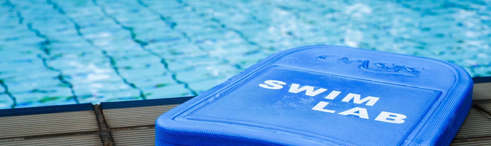 A The Swim Lab Kickboard on the Edge of the Pool