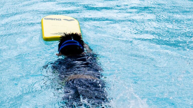 A Boy Learning To Swim at The Swim Lab