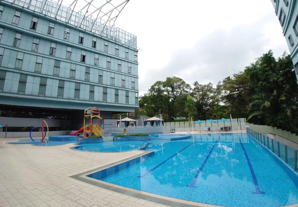 Pool-level view of the NTU@one-north swimming facility, capturing the serene waters of the 3 x 25m lap pool and adjacent learning pods.