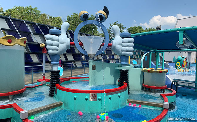 Children enjoying interactive water features at Waterworks, Science Centre SG in Jurong East.